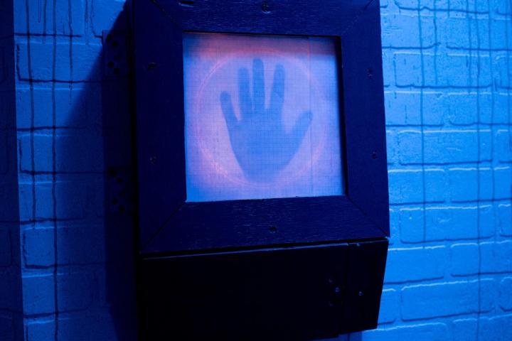 blue screen with hand print on screen